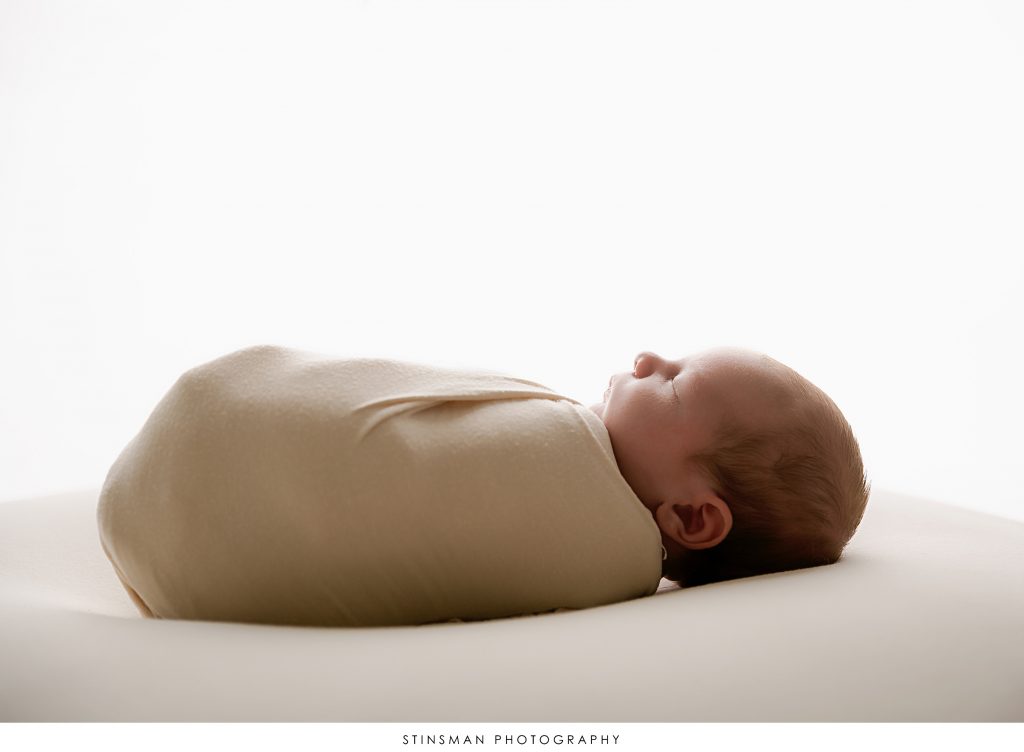 baby boy profile photo in newborn session.