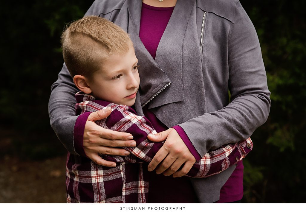 little boy hugging his mom