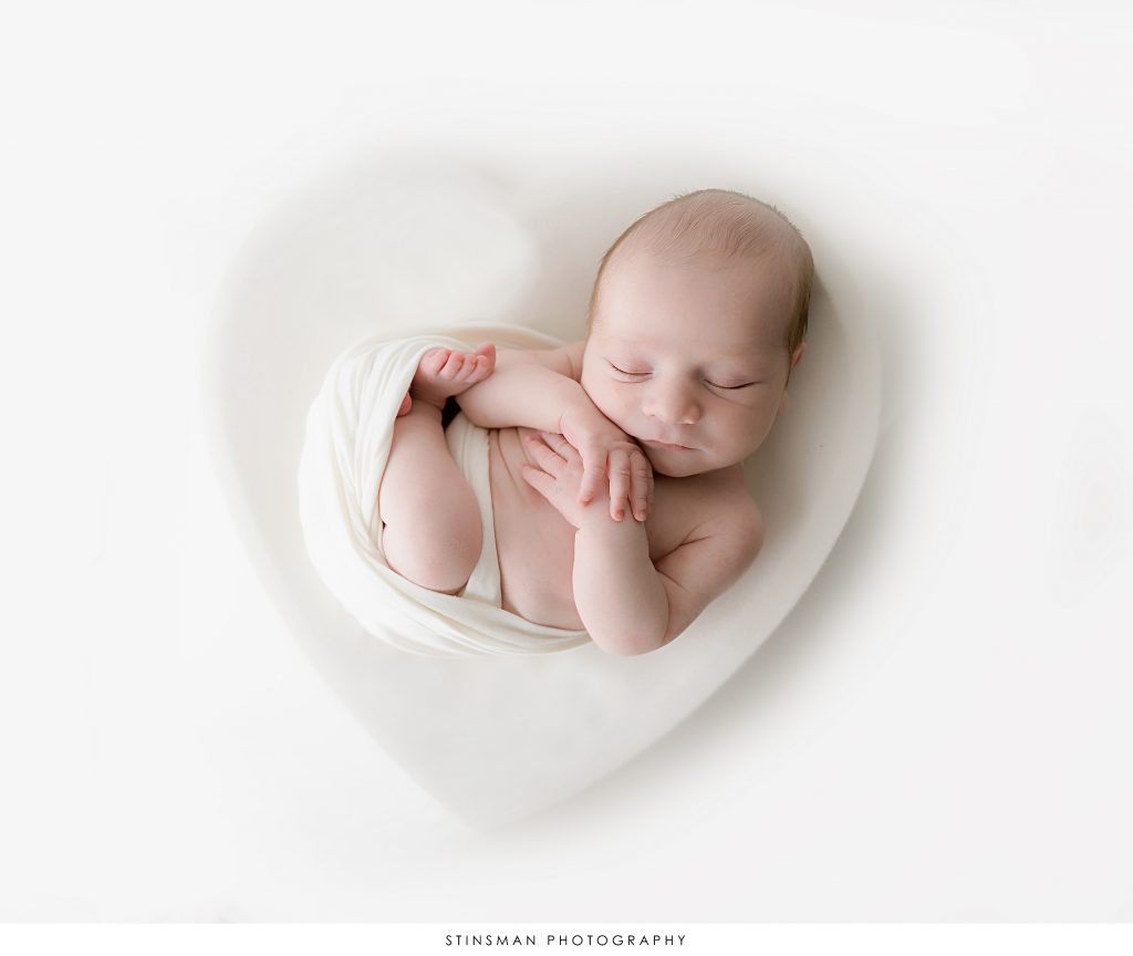 newborn photo with baby in a heart
