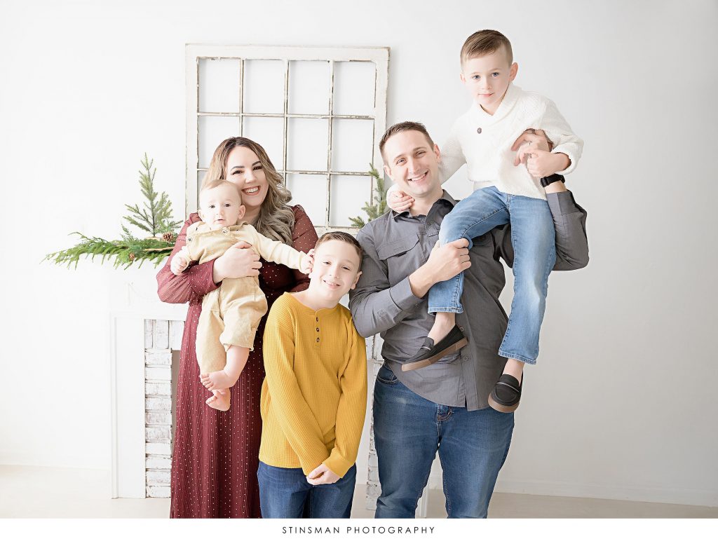 Family smiling at family photoshoot