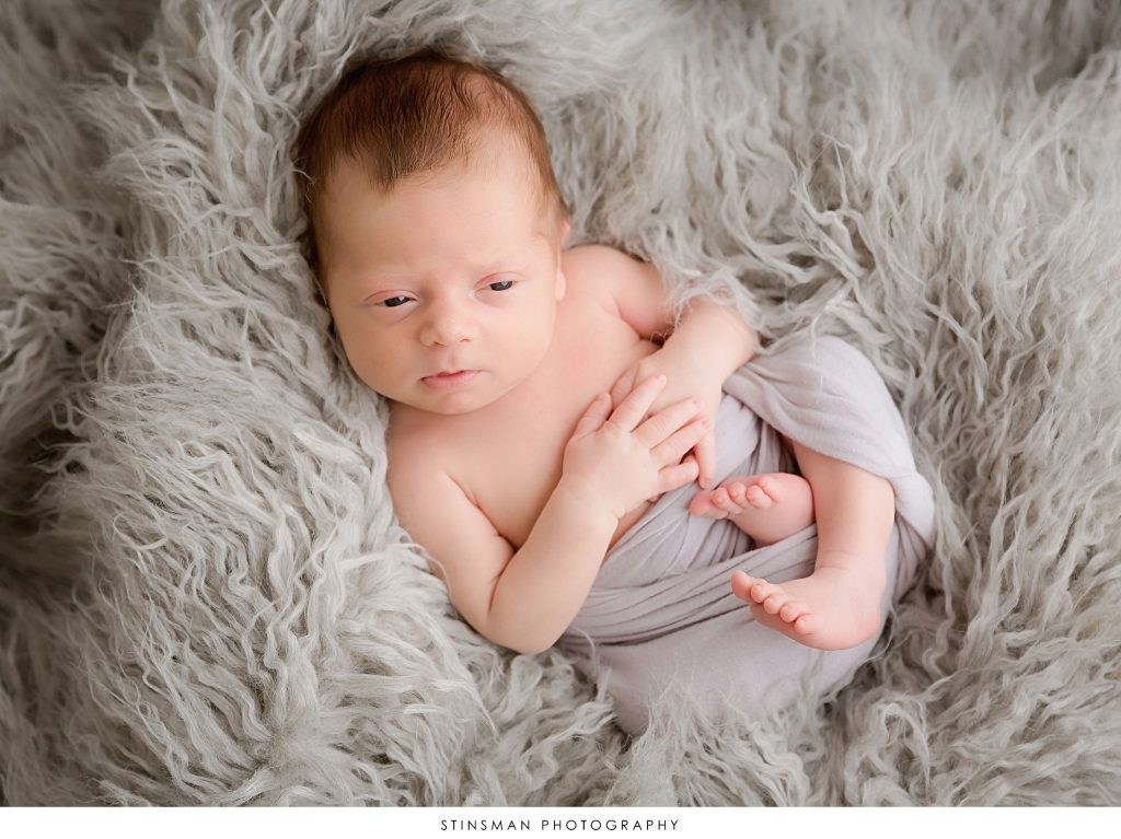 Newborn baby boy awake at his newborn photoshoot