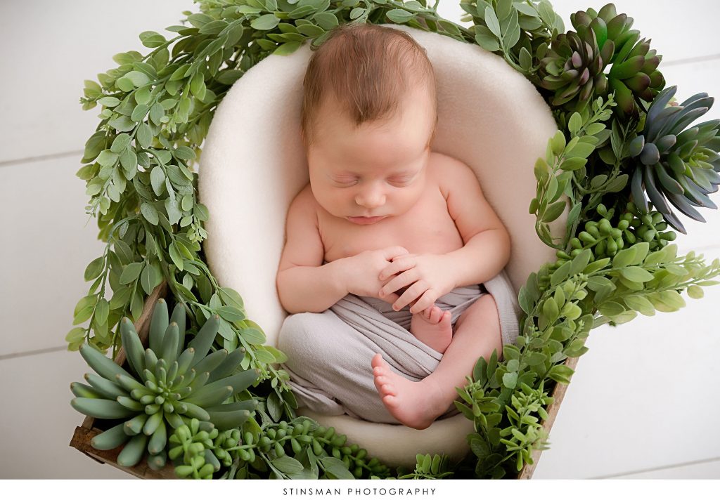 Sleeping baby boy at his newborn photoshoot