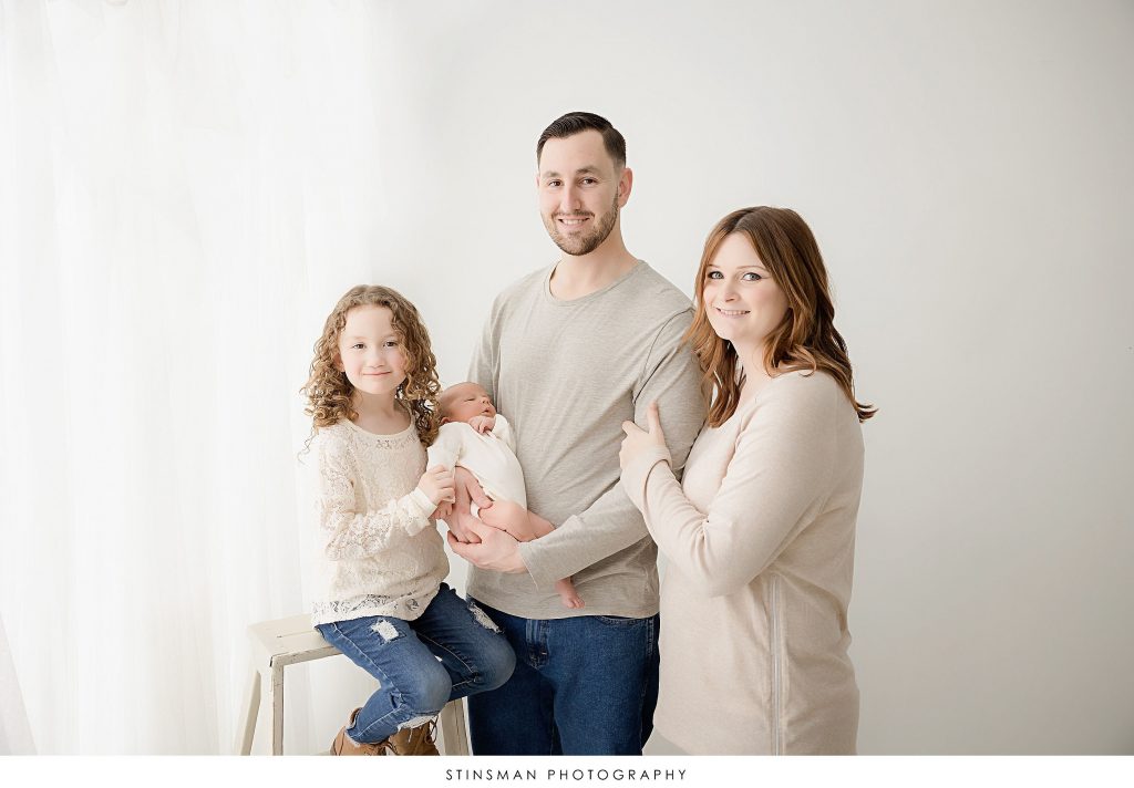 Family posed at their newborn photoshoot