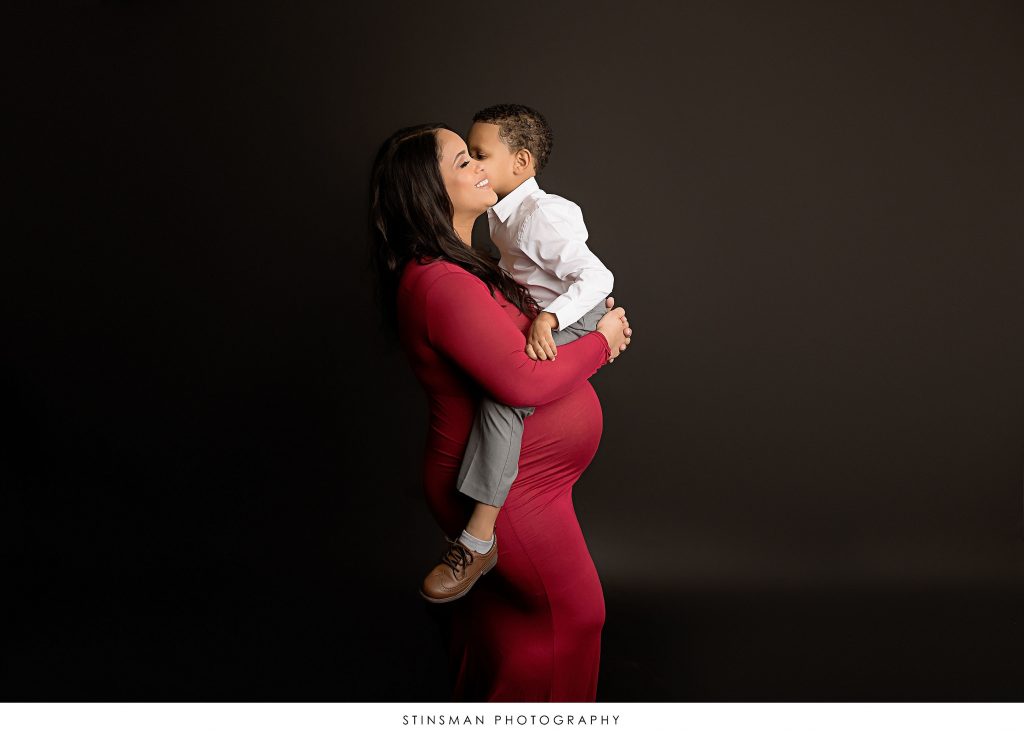 Pregnant mom with her son at her maternity photoshoot
