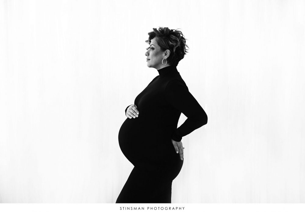 Pregnant mom posed in black and white maternity photoshoot