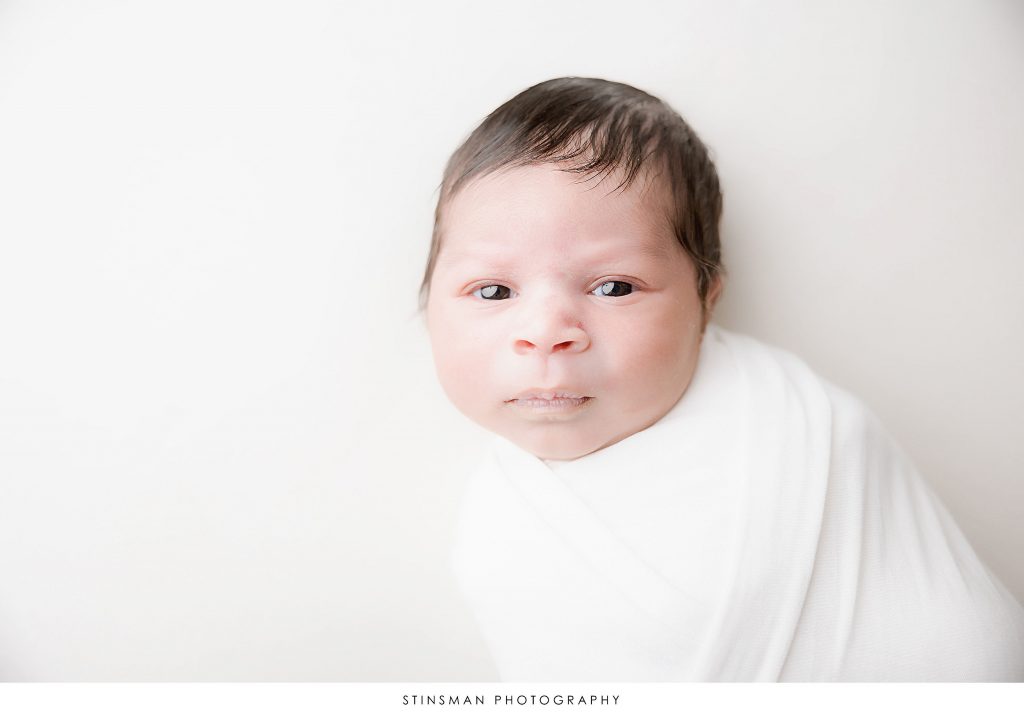 Newborn baby girl awake at her newborn photoshoot