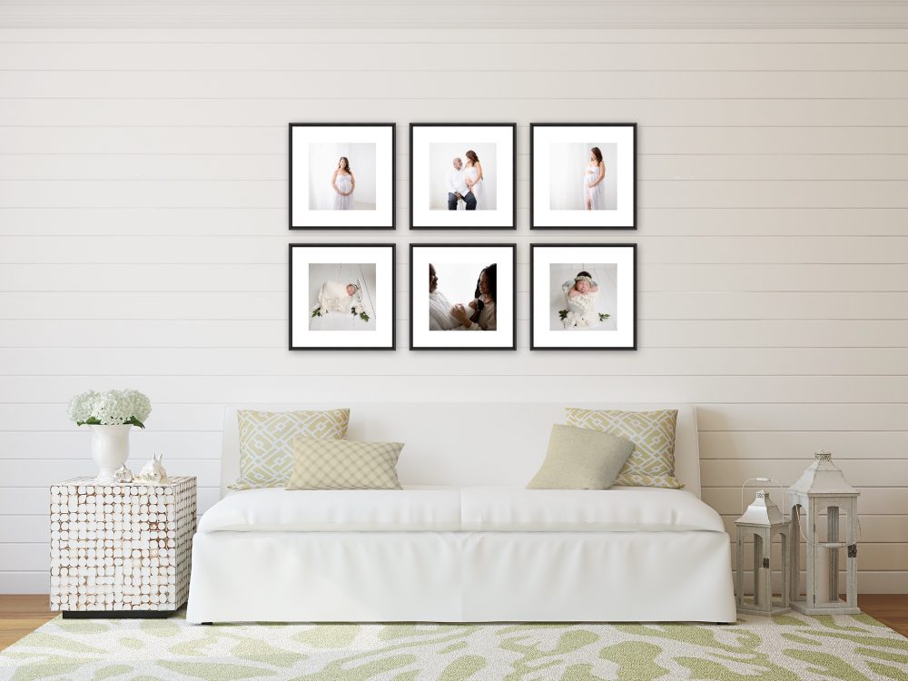 african american family with photos on the wall from their maternity and newborn photo shoots