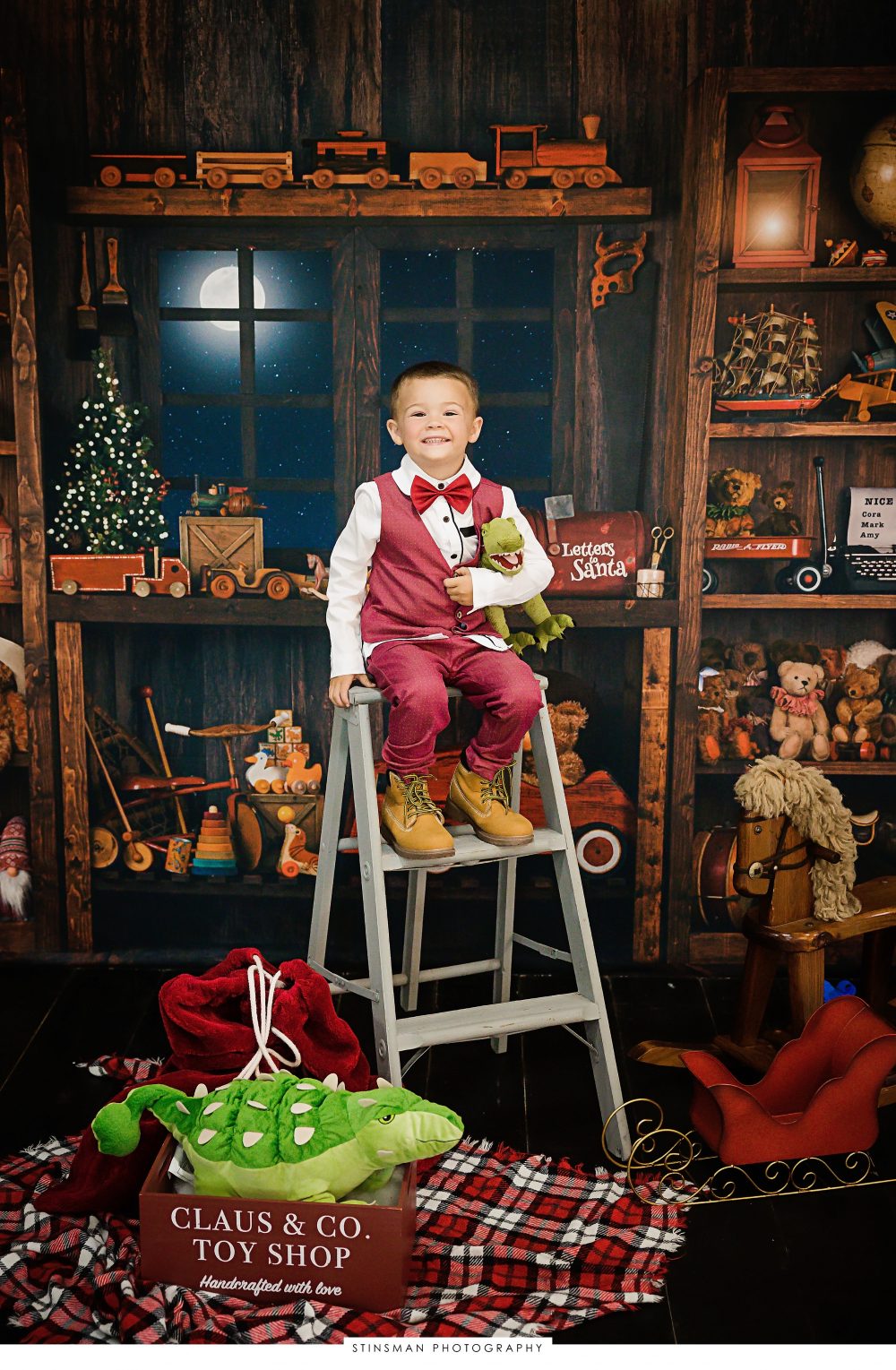 little boy wearing red for his holiday photo shoot
