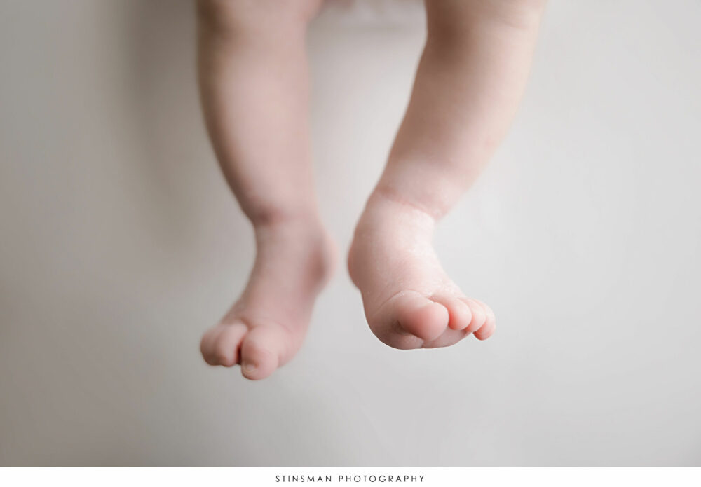 Newborn baby girl's toes pictured at her newborn photoshoot