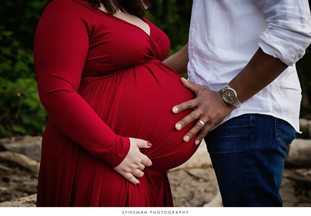 Parents to be posing at their maternity photoshoot