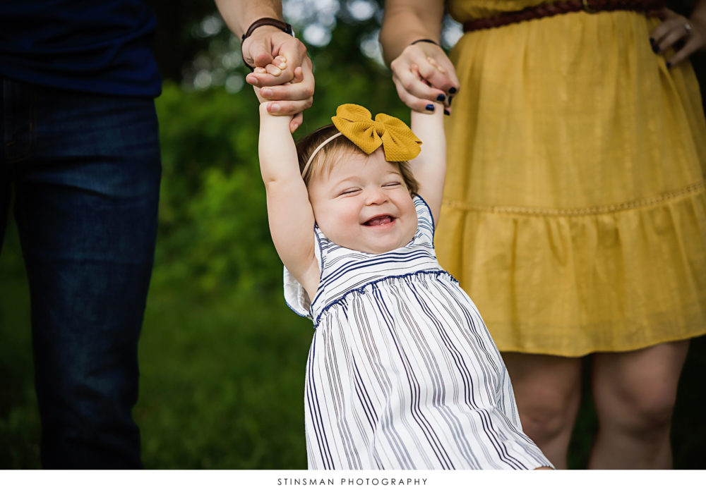 Baby girl swinging at her milestone photoshoot