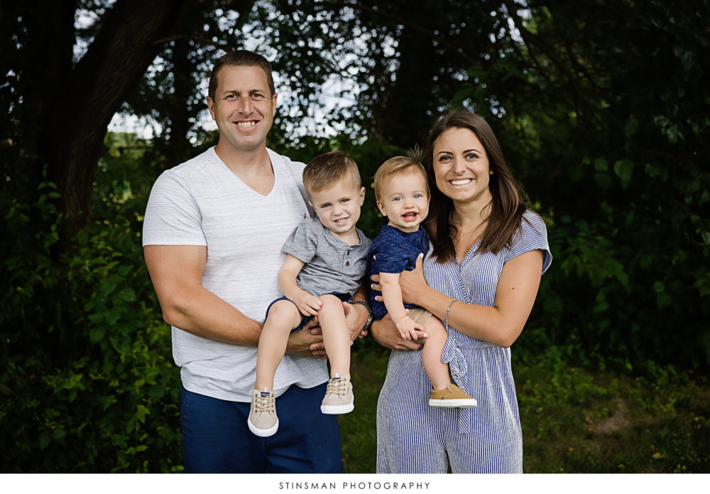 Family posing at their son's milestone photoshoot