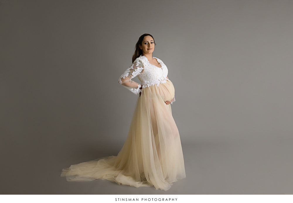 Pregnant mom in a boho dress at her maternity photoshoot