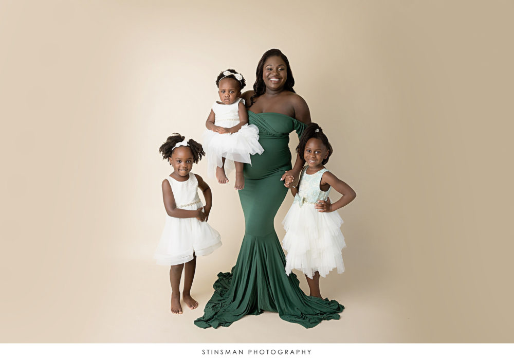 Mom to be with her daughters a her maternity photoshoot