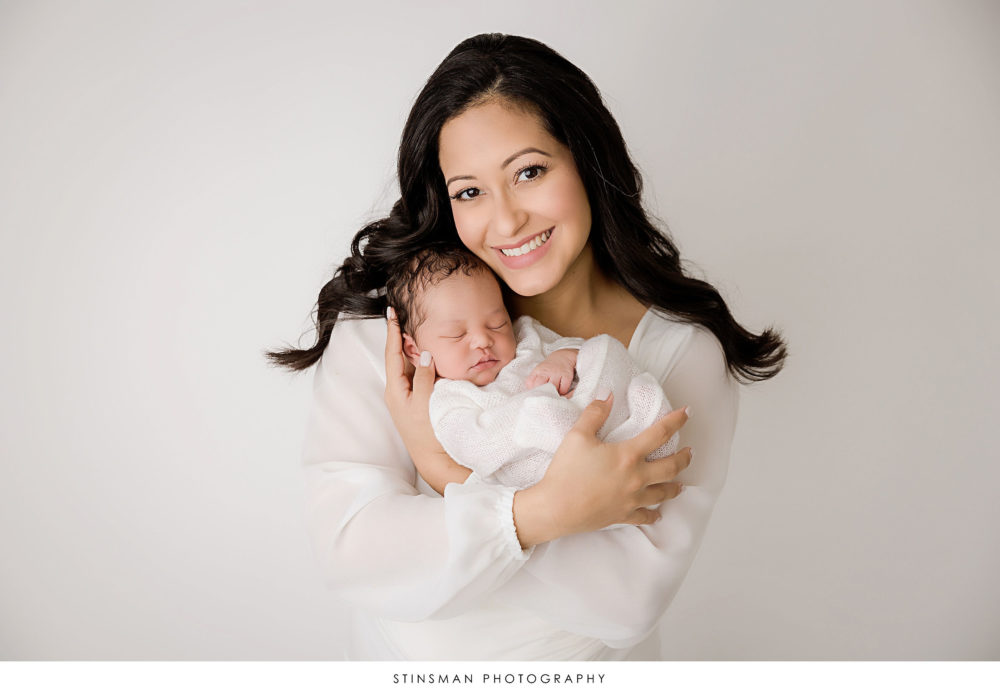 Newborn baby girl with her mom at her newborn photoshoot