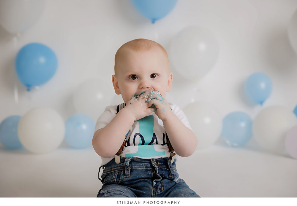 One year old boy posed at his milestone photoshoot