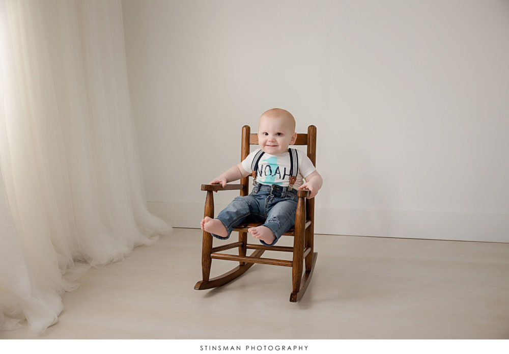 One year old boy posed at his milestone photoshoot