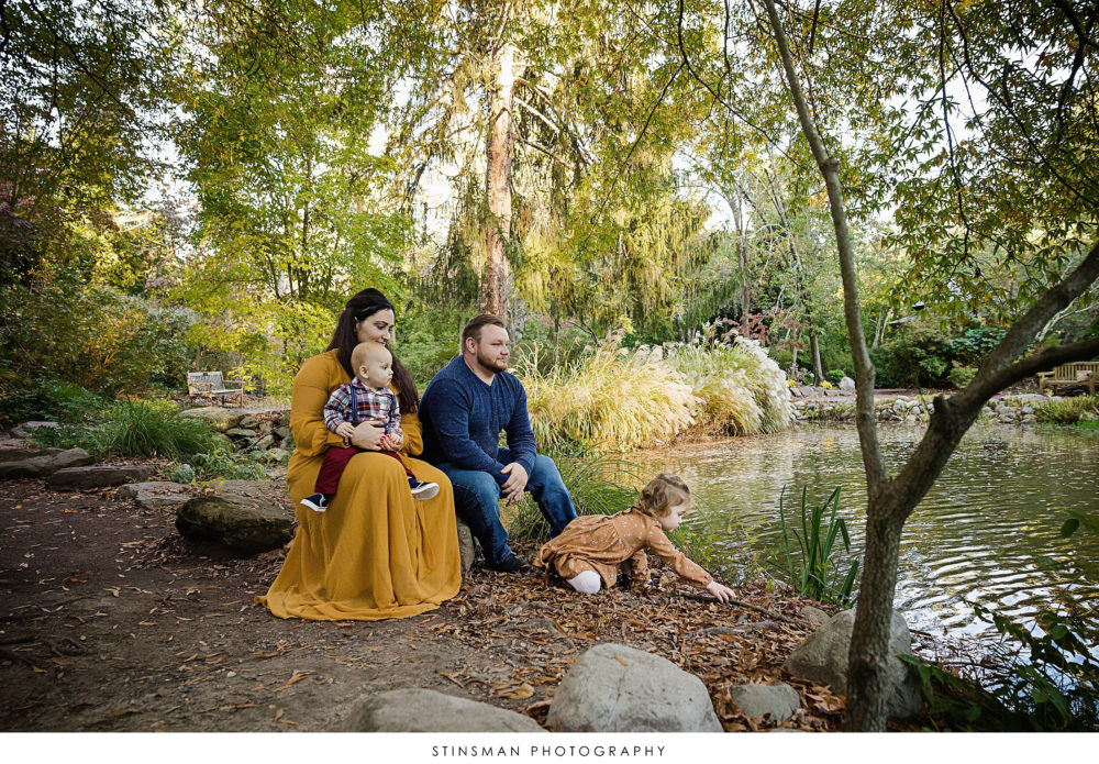 Family overlooking a pond at their family photoshoot