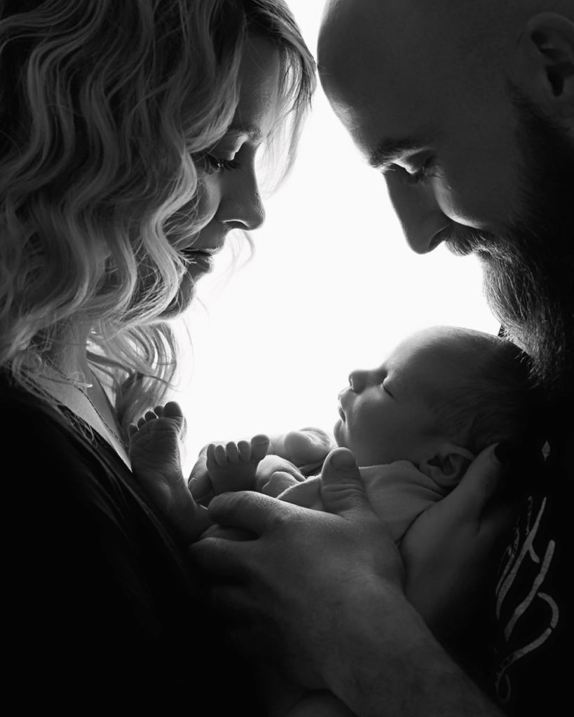 Close up of mom, dad and new baby for their black-and-white maternity and newborn session in Camden, New Jersey.