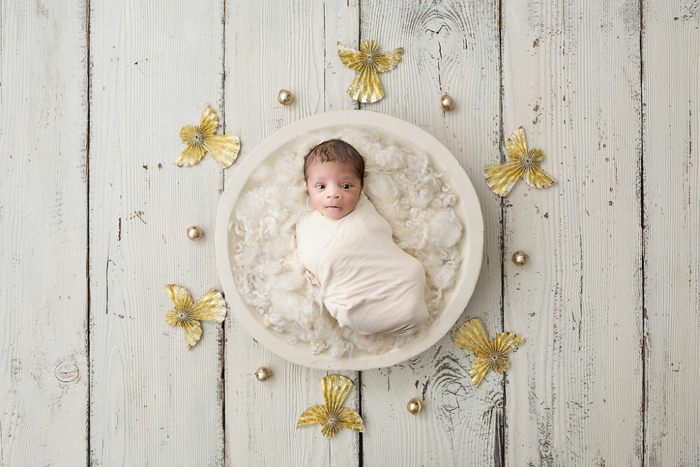 Newborn boy wrapped in swaddle for his warm and earthy newborn session in Southampton, New Jersey.