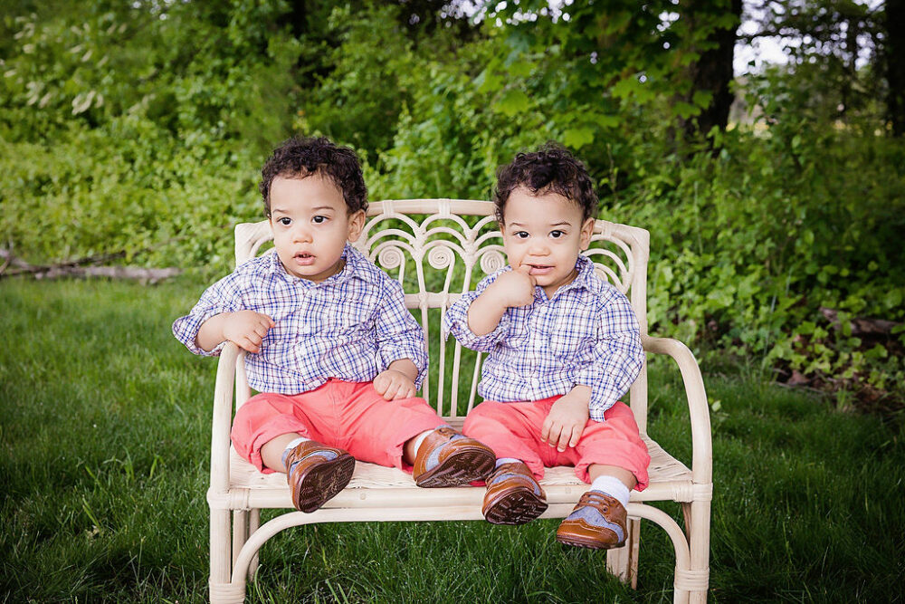 Twin boys in matching outfits for their wild one first birthday session in Camden, New Jersey.