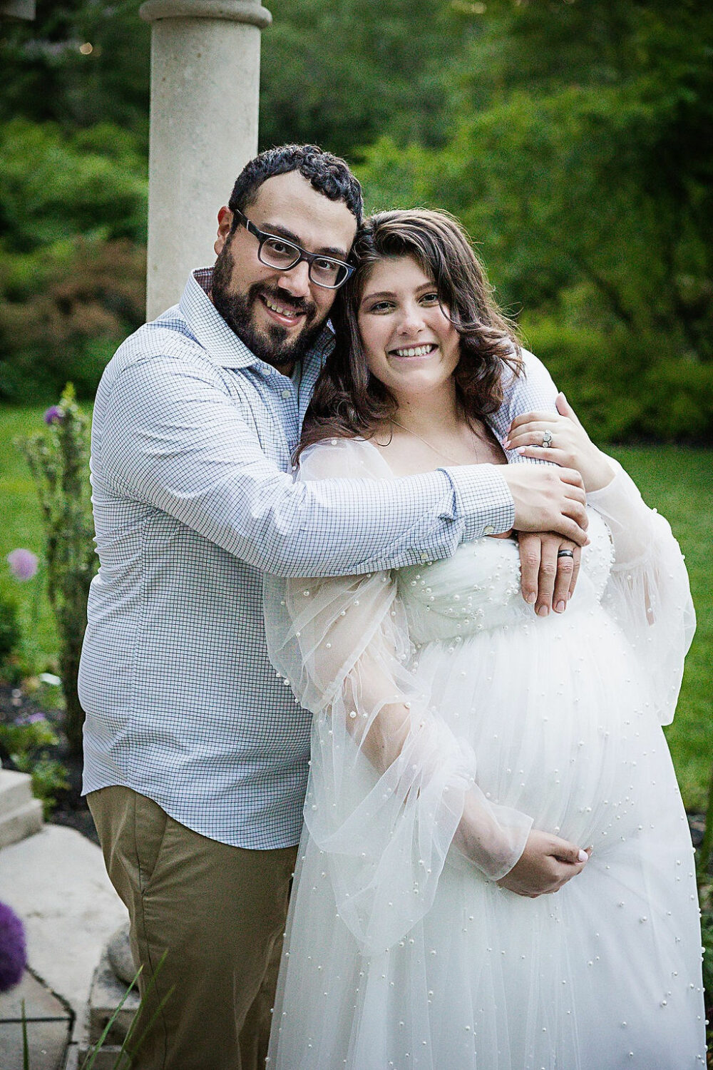 Close up portrait of husband hugging pregnant wife for their Spring Garden maternity session in Trenton, New Jersey.