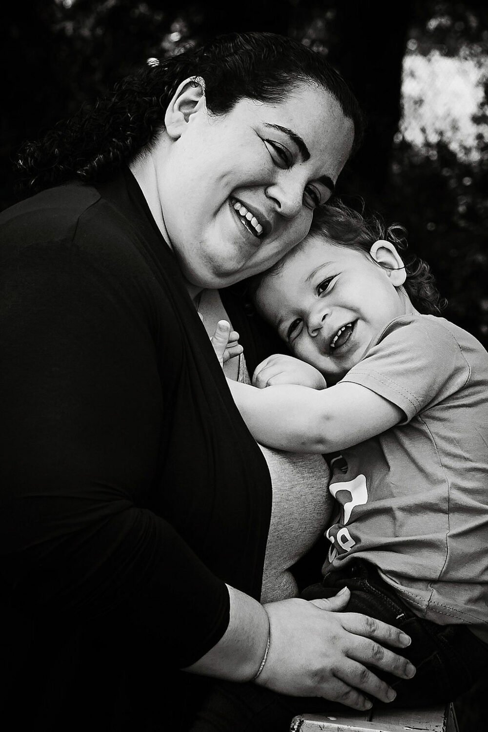 Black-and-white portrait of a mother and her two-year-old daughter, taken for professional, baby photos taken in Moorestown, New Jersey.