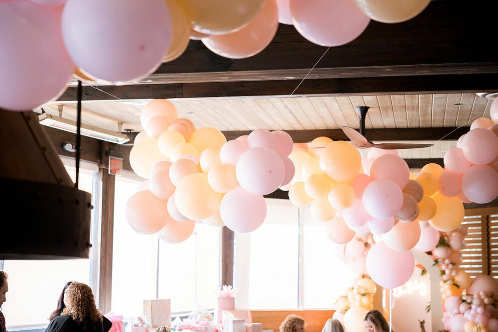 Various balloons hung in restaurant venue for a baby shower event photo shoot in South Philadelphia.