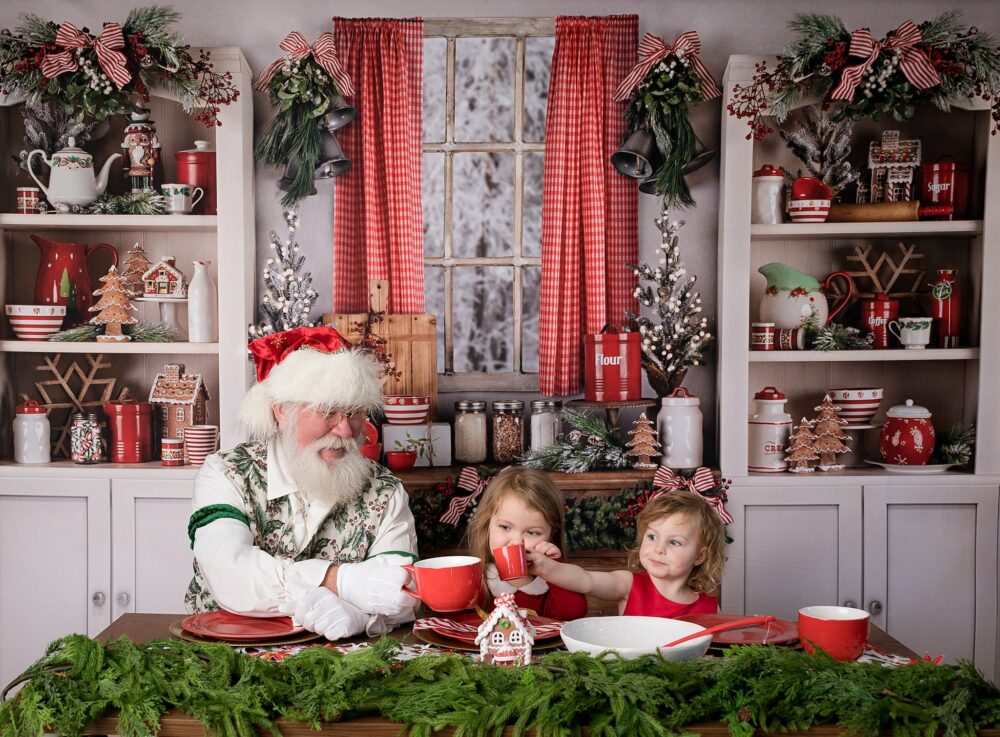 Children cheering with santa with hot cocoa