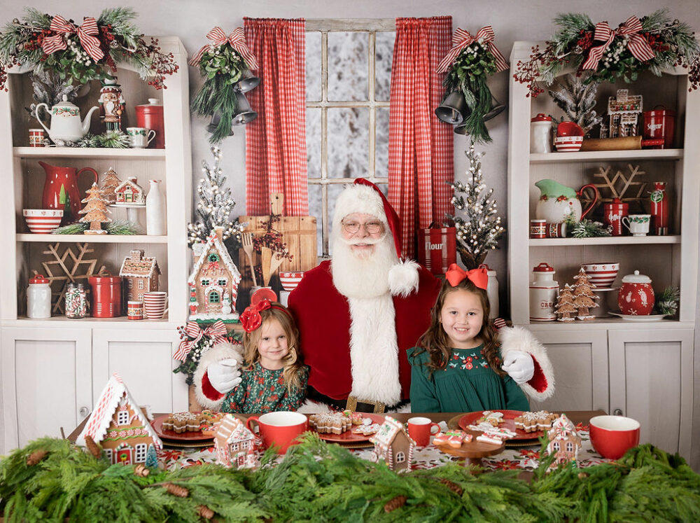 Santa Claus sitting in the kitchen photography sat smiling with toddler girls for their South Jersey Christmas Santa mini session at Southampton, New Jersey.