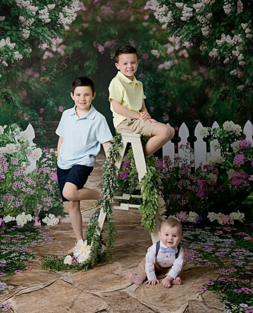 In studio flower and garden mini session backdrop with three brothers in south jersey photo studio.